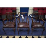 THREE MATCHING WOOD FRAMED LEATHER UPHOLSTERED ARMCHAIRSPlease read the following important