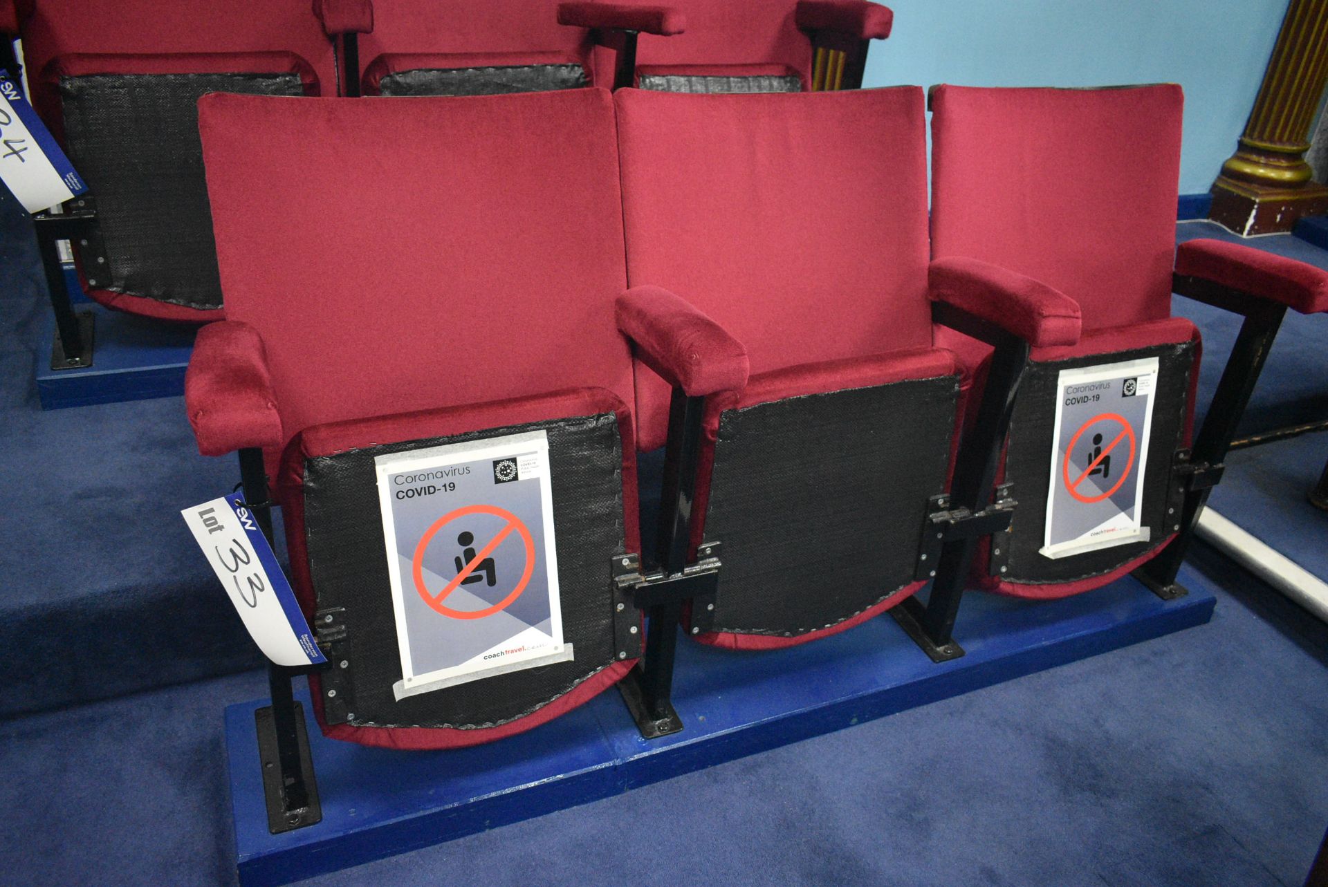 Bank of Three Red Fabric Upholstered Fold-up Seats, 1.6m wide overallPlease read the following