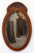 Spiegel, um 1900, ovaler Mahagonirahmen mit Bekrönung Messingapplik,, facettiertes Glas, 92x58 cm