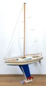 Modell-Segelboot, um 1970, Holz, farbig bemalt, mit Stoffsegeln, auf Ständer, 170x94x25 cm