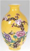 Vase,  China, unterseitig Chien-Lung-Marke, gelber Fond mit polychromer Bemalung, Pflaumenblütenzwe