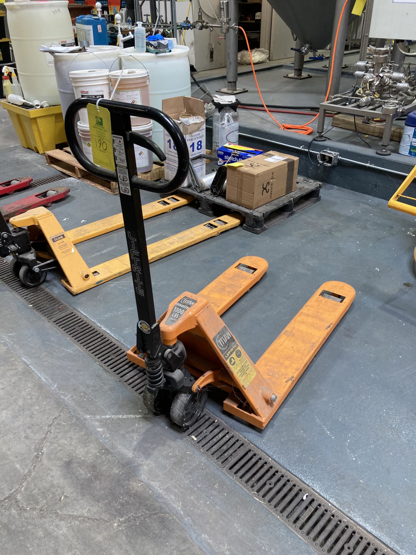 Titan pallet jack, 5500 lbs Rigging fee of __$25__ to be added to the winning bidder's invoice.