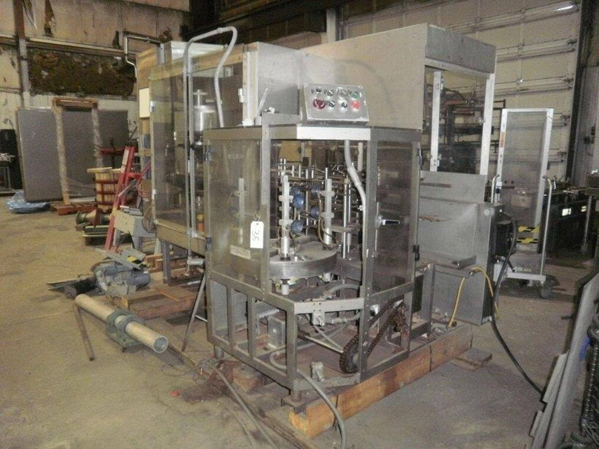 PMI Vertical Cartoner with 10" pitch & a Volumetric filler, was running a siftproof carton (Glue - Image 4 of 5