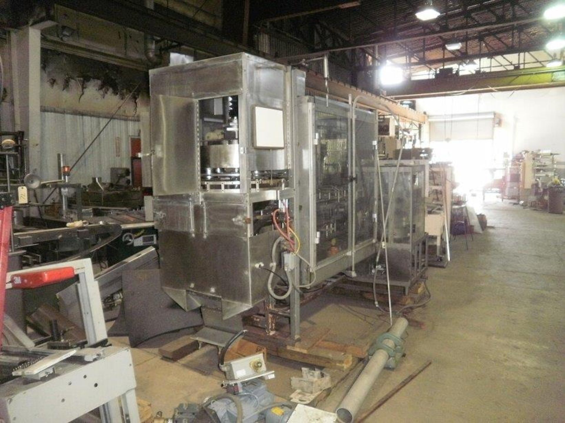 PMI Vertical Cartoner with 10" pitch & a Volumetric filler, was running a siftproof carton (Glue - Image 2 of 5