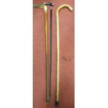 A quantity of Walking sticks to include a Silvered topped example. Longest 97 cms approx.