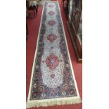 An as new Kashmir Runner with cream,red and blue ground.510 X 79 cms.