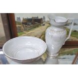 An early 20th Century Wash hand Basin and Jug with iridescent ground.