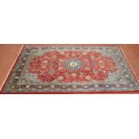 A large Persian Carpet. 330 x 218 cm.