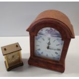 A modern Bracket Clock along with a carriage clock along with a Figure of a Sheppard and his sheep.