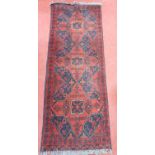 A nice Burgundy ground Rug with repeating pattern.54 X 153 cms.