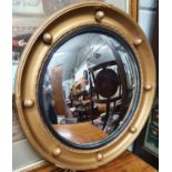 A late 19th -Early 20th Century Gilt Convex Mirror.D 47 cms.