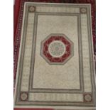 A cream ground Rug with wine border and centre. 195 x 137 cms.
