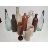 A group of Stoneware and Glass Bottles.