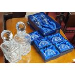 Two Irish Ships Decanters,two Champagne Flutes and five Paperweights,all with Celtic design.