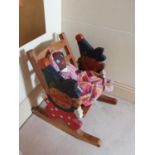 A decorative Dolls Rocking Chair with doll.