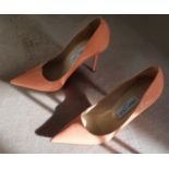 A good and hardly worn pair of Jimmy Choo Shoes. Salmon in colour and size 5 (38).