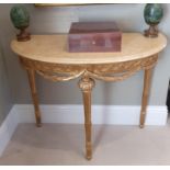 A lovely Timber Gilt half moon Side/Console Table with cream marble top and highly carved outline.