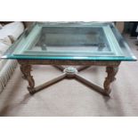 A good highly carved timber Coffee Table with glass top.