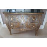 Withdrawn. A Fabulous Serpentine Silver and Gilded Chest of Drawers with cabriole supports.