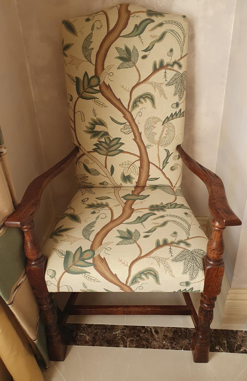 A lovely pair of Carolean style Oak Armchairs with leaf upholstery. Total height 120 x 65 cms.