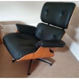 A really good Retro arm Chair with foot stool, possibly by Eames.