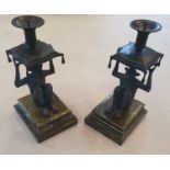 A good pair of Bronze effect Candlesticks in the shape of a Monkey. On marble bases.