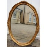 A good gilt oval mirror.