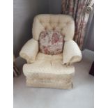 A good pair of Gold upholstered Armchairs with deep buttoned backs.