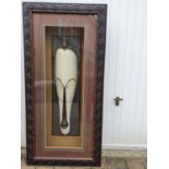 A very large African head in relief in a fully lit Frame. 77 x 160 cms approx.