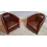 A fantastic pair of brown leather Club Chairs in the Art Deco style with a ribbed upholstered
