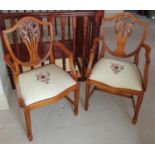 A lovely pair of Hepplewhite Carvers with Fleur de Lys backs and hand embroidered seats.