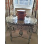 An oval Silvered Metal Table with gallery top. 75 x 56 x H 66 cms.