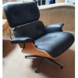 A really good Retro arm Chair with foot stool, possibly by Eames.