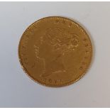 An 1851 Gold Half Sovereign.