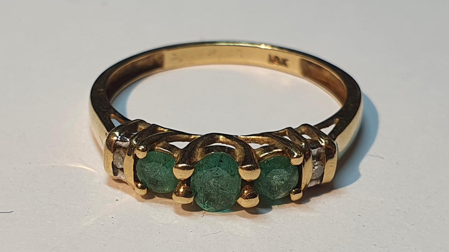 Emerald and diamond band ring, stamped 18K, ring size M, 1.5gms.