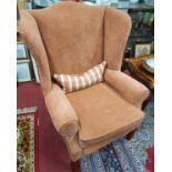 A pair of Georgian style Wingback Armchairs, upholstered in salmon pink fabric. W 84 cm approx.