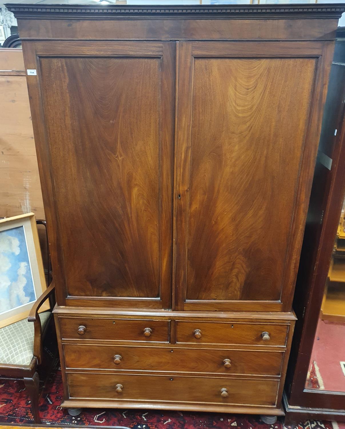 A good 19th Century Mahogany Linen Press with fitted shirt drawers over two long and two short