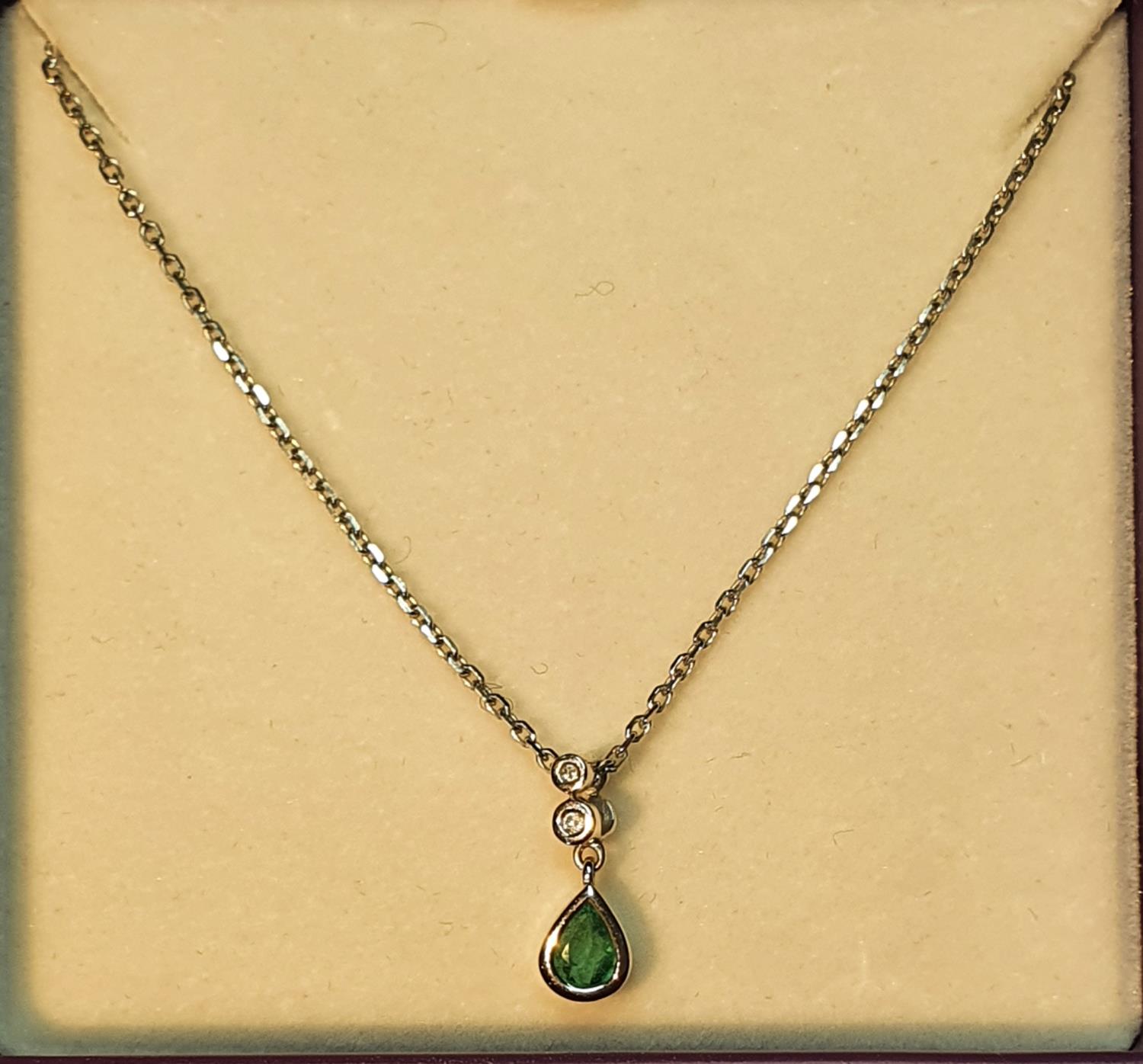 Emerald and diamond pendant, suspended from a 9ct gold chain, hallmarks for Sheffield, stamped