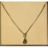 Emerald and diamond pendant, suspended from a 9ct gold chain, hallmarks for Sheffield, stamped