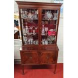 A good Early 20th Century Mahogany two door Bookcase on square tapered supports.W 92 X D 43 X H