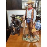 Two John Wayne Figures.