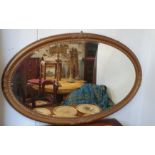 A very large 19th Century oval plaster and timber gilt Mirror with beveled glass. 140 x 89 cm