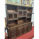 A superb 20th Century highly carved Oriental style Cabinet with raised back. W 195 x D 46 x H 191 cm