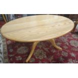 An Ercol Golden Dawn Elm Coffee Table on quatrefoil base. 71 x 121 x H 51 cm approx.