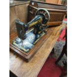 A good cased Singer Sewing Machine. W 46 x 24 x H 30 cm approx.