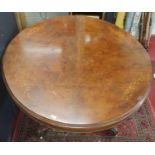 A fantastic Victorian Walnut Inlaid oval Supper Table with splayed carved pod. c1860. 145 x 117