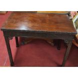 A superb 19th Century Mahogany fold over Card Table in the Chinese Chippendale manner with highly