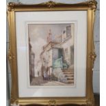 A 19th Century Watercolour of a street and fishermen's cottages. Indistinctly signed. In a nice gilt