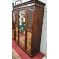 A late 19th Century Walnut three door Wardrobe along with its Dressing Table partner.