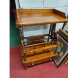 A Victorian Walnut veneered three divisional Canterbury, with pierced scrolling side brackets and